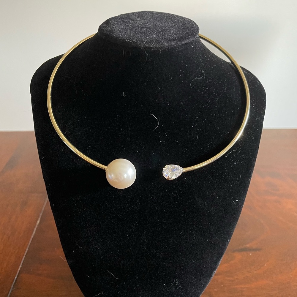 Gold tone torque with oversized faux pearl and pear shaped crystal unmarked